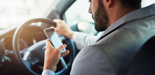 Male-Using-Phone-While-Driving